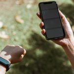 Heart Rate - Crop anonymous woman in smart watch surfing internet on smartphone