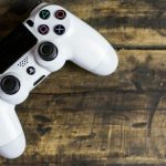 Gaming - White Gaming Console on Wooden Surface