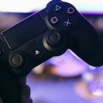 Console - Person Holding Sony Ps4 Dualshock 4