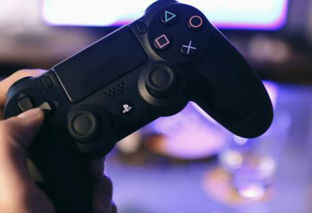 Console - Person Holding Sony Ps4 Dualshock 4