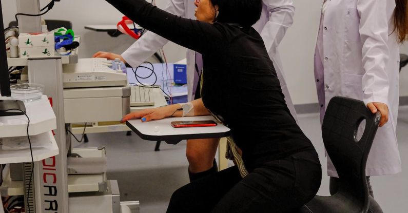 Diagnose - Young Doctors Looking at the Screen of a Medical Equipment