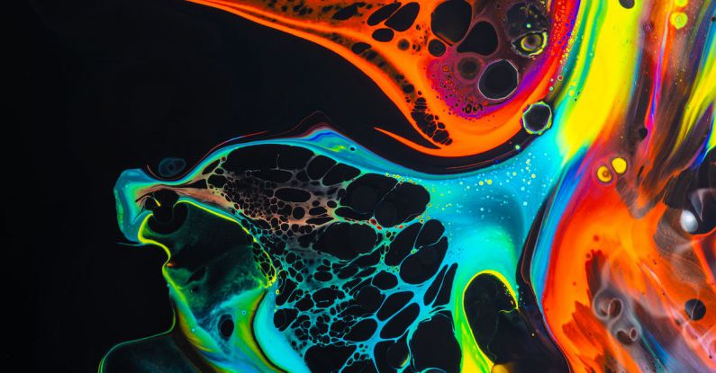 Liquid Cooling - Colorful mix of neon paints swirling on black surface