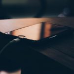 Charging - Shallow Focus Photography of Black Iphone 7 on Brown Wooden Table