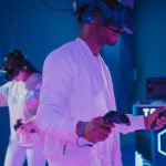 Controllers - Man Playing a Video Game while Wearing a VR Headset