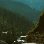 Self-driving Cars - Black Car on Road Near Green Trees