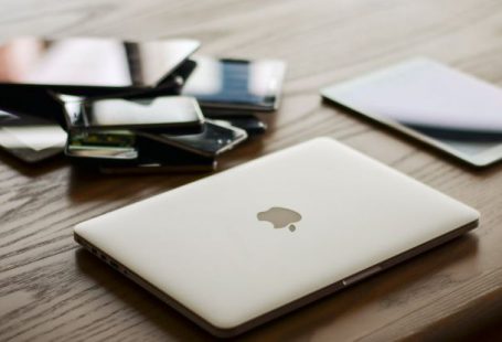 Smartphones - Macbook and Ipad on Desk