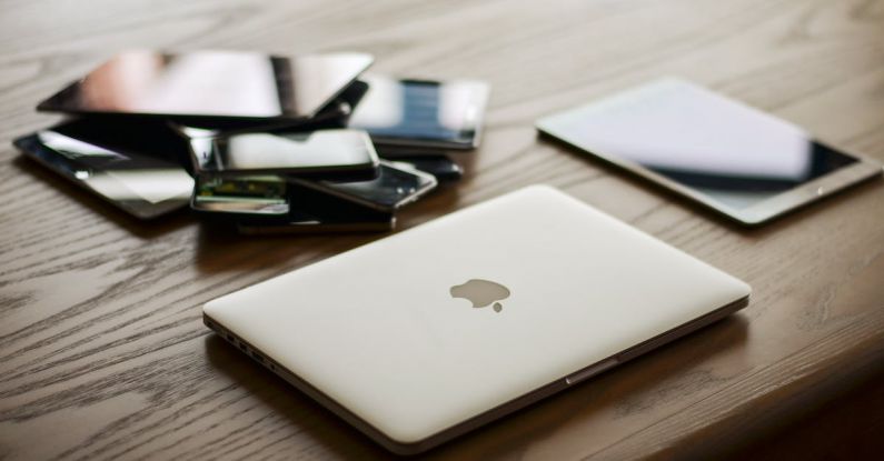 Smartphones - Macbook and Ipad on Desk